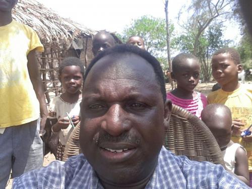 Reverend Barnet Kapten, leader of Mombasa Children's Provision Project, with orphans